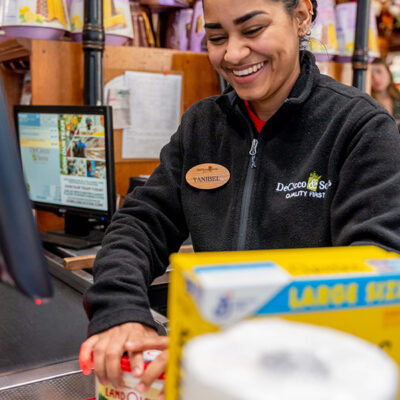 DeCicco & Sons employee, Yanibel, scanning at the cash register